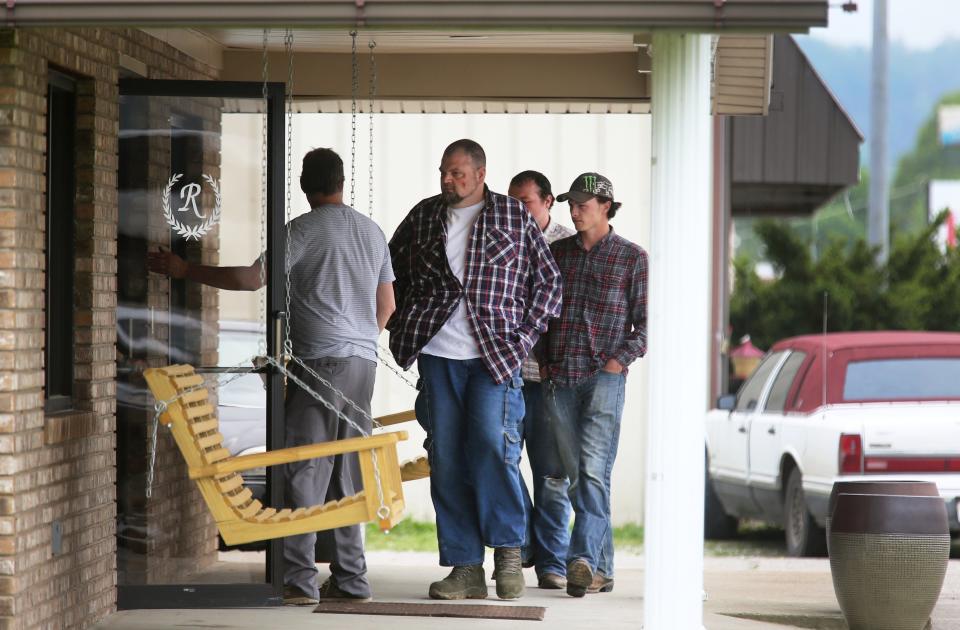 George "Billy" Wagner III (center) and sons George Wagner IV (center back) and Edward "Jake" Wagner (right) attend the funeral of Gary Rhoden, 38, in Greenup, Kentucky, on April 27, 2016. Two years later, each member of the Wagner family, including Billy's wife, Angela, was charged with 22 counts in connection with the shooting deaths of Gary Rhoden, six other Rhodens and one future Rhoden.