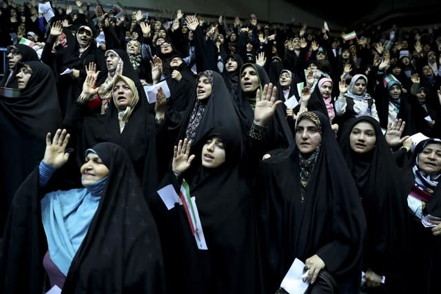 Veiled Iranian women attend a ceremony in support of the observance of the Islamic dress code for women, in Tehran