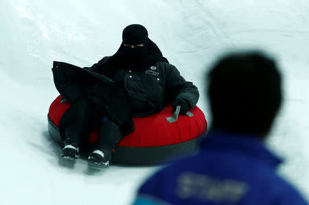 A veiled Saudi woman enjoys a ride in the new Snow City at Al Othaim Mall in Riyadh, Saudi Arabia July 26, 2016. Picture taken July 26, 2016. REUTERS/Faisal Al Nasser