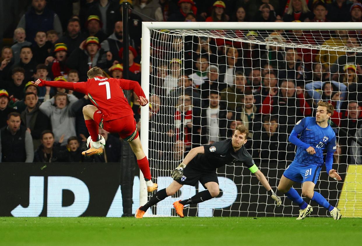 David Brooks leaps on to a rebound to put Wales in front (REUTERS)