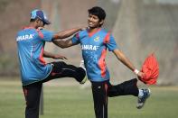 Bangladesh’s Anamul Haque, right, and Naeem Islam stretch during a practice session ahead of the Asia Cup tournament in Dhaka, Bangladesh, Monday, Feb. 24, 2014. Pakistan plays Sri Lanka in the opening match of the five nation one day cricket event that begins Tuesday. (AP Photo/A.M. Ahad)
