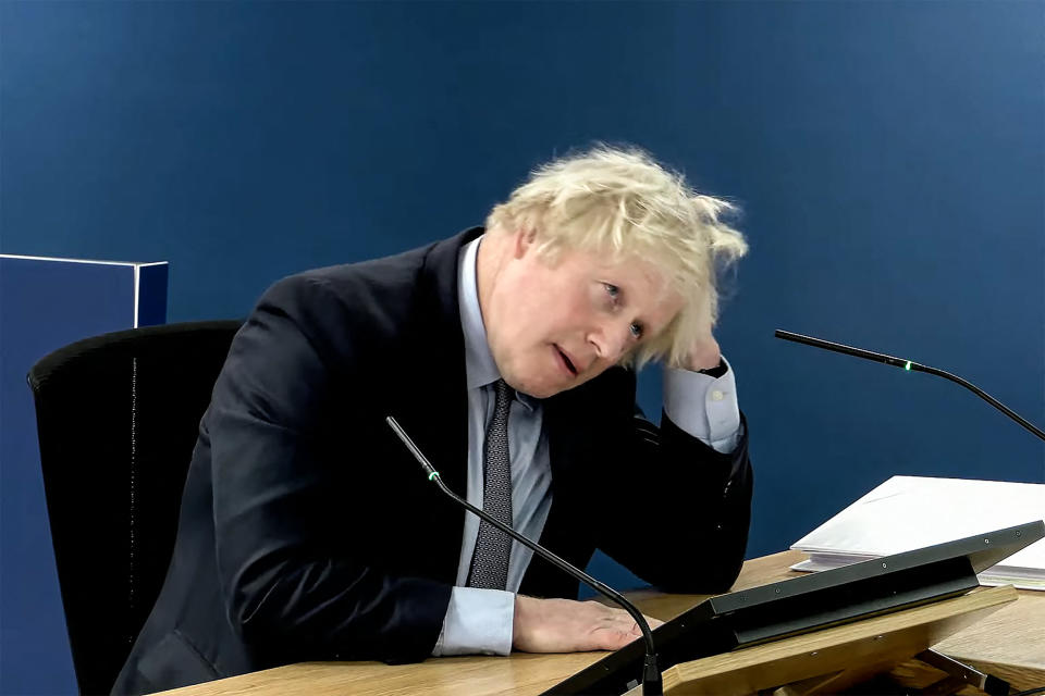 TOPSHOT - A video grab from footage broadcast by the UK Covid-19 Inquiry shows Britain's former Prime Minister Boris Johnson speaking at the UK Covid-19 Inquiry, in west London, on December 6, 2023 to give evidence. Former UK prime minister Boris Johnson will face tough questioning at a public inquiry on December 6, 2023 over his government's handling of the Covid-19 pandemic, after a barrage of criticism from his former aides. Johnson, who has been accused of indecisiveness and a lack of scientific understanding, is expected to admit that he 