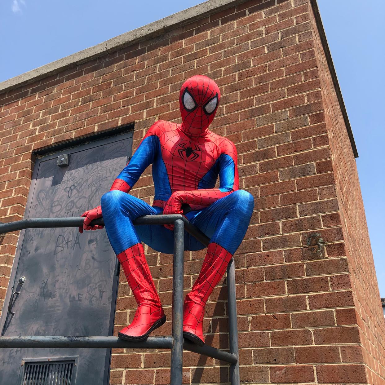 Spider-Man sits atop the Staunton city garage on Saturday, June 17, 2023.