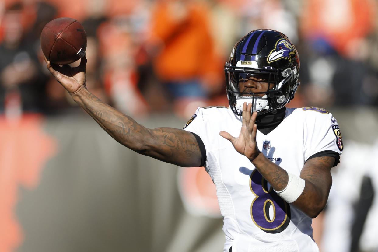 Baltimore Ravens quarterback Lamar Jackson warms up before an NFL football game against the Cleveland Browns, Sunday, Dec. 12, 2021, in Cleveland. (AP Photo/Ron Schwane)