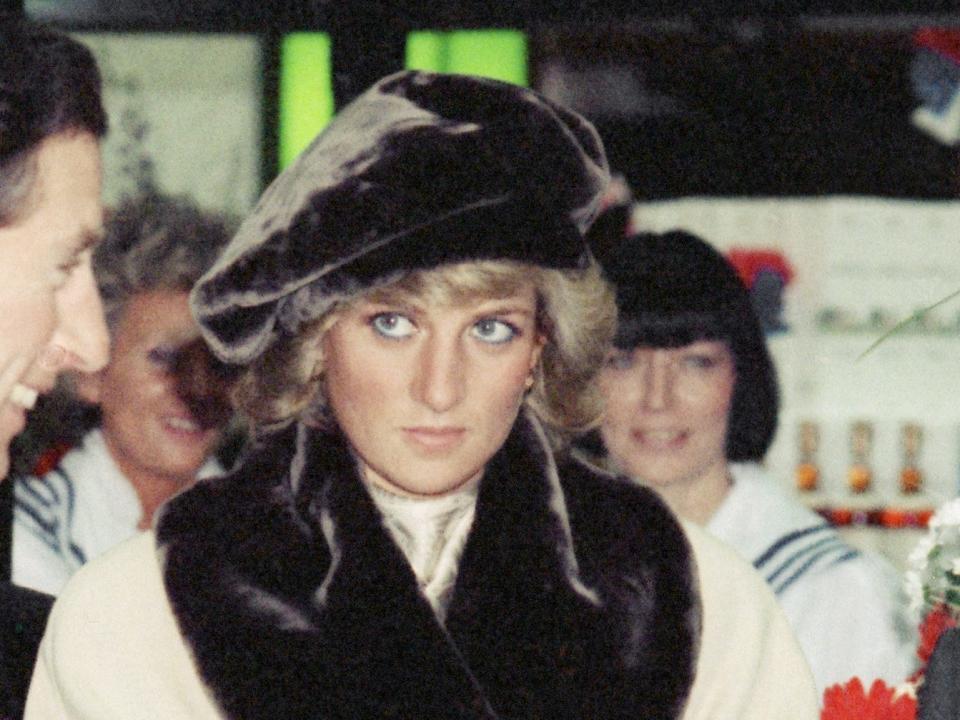 Princess Diana wearing a brown fur hat designed by Stephen Jones in 1987.