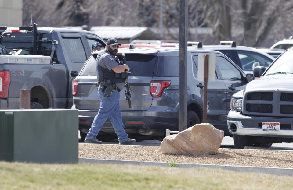 A heavy police presence patrols outside of the Twin Falls Court House while two of the suspects in an attack on corrections officers at a Boise, Idaho, hospital appeared before a judge, Friday March 22, 2024, in Twin Falls, Idaho. (AP Photo/Kyle Green)