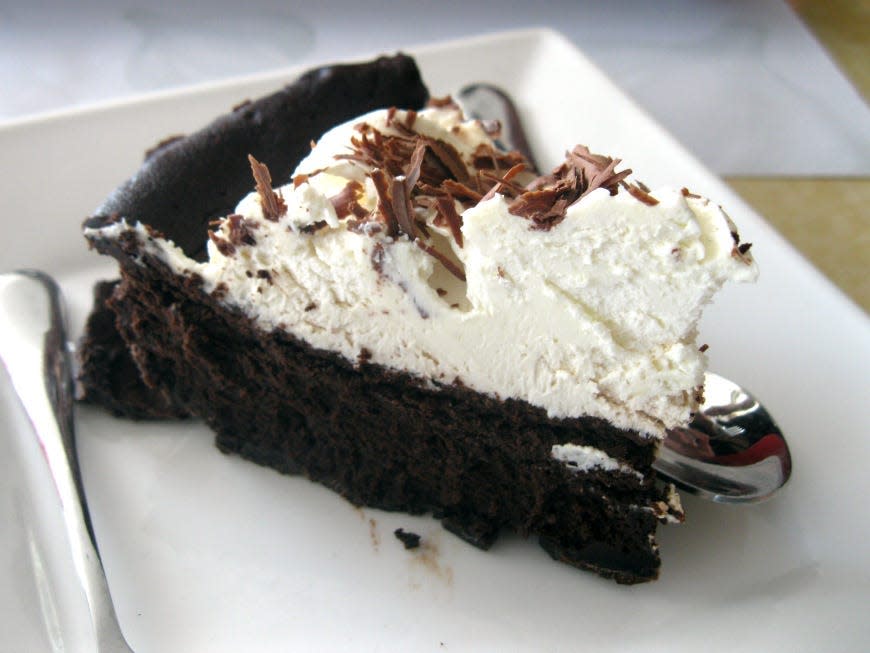 Mississippi mud pie with chocolate crust on a white plate