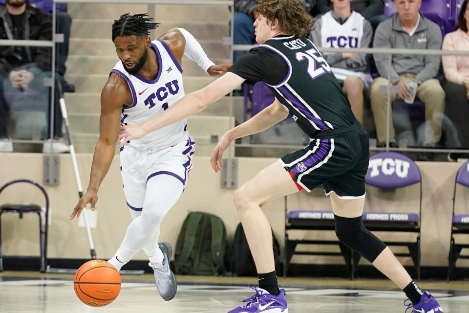 TCU guard Mike Miles Jr. (1) gets the steal against Central Arkansas guard Elias Cato (25) during the first half of an NCAA college basketball game in Fort Worth, Texas, Wednesday, Dec. 28, 2022. (AP Photo/LM Otero)