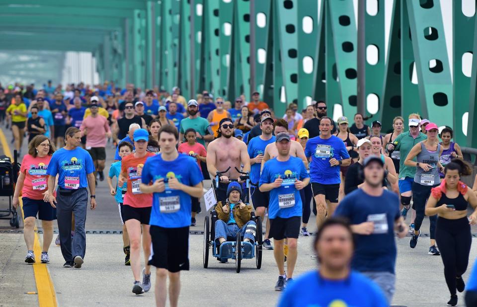 Runners make their way over the Hart Bridge during Saturday's 2022 Gate River Run. Thousands of runners made their way through the 15K course of the 2022 Gate River Run Saturday in Jacksonville, Florida, on March 5, 2022.