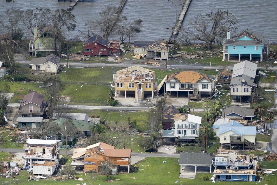 Buildings and homes are damaged in the aftermath of Hurricane Laura Thursday, Aug. 27, 2020, near Lake Charles, La. (AP Photo/David J. Phillip)