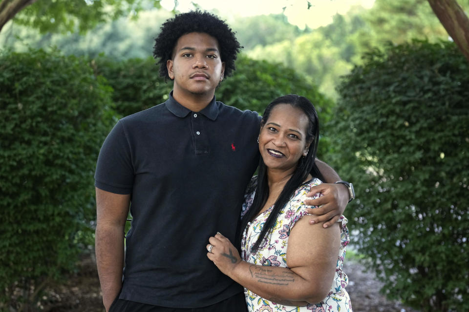 Robin Alderman, right, and her son, Camden Alderman, 21, pose for a portrait near their home in Greensboro, N.C., Wednesday, June 12, 2024. Camden, 21, was diagnosed as a baby with a rare disease called Wiskott-Aldrich syndrome, which is caused by a mutated gene on the X chromosome. It primarily affects boys – up to 10 out of every million — and can cause frequent infections, eczema and excessive bleeding. (AP Photo/Chuck Burton)