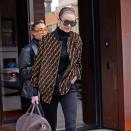 Gigi Hadid is on her way to Milan Fashion Week, and she’s already paying homage to the Italian fashion capital.