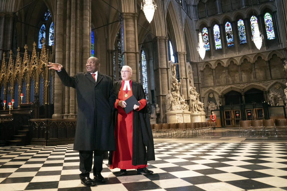 South African President Cyril Ramaphosa, left, visits Westminster Abbey accompanied by the Dean Of Westminster Abbey The Very Reverend David Hoyle, as part of his state visit, in London, Tuesday Nov. 22, 2022. (Stefan Rousseau/Pool photo via AP)