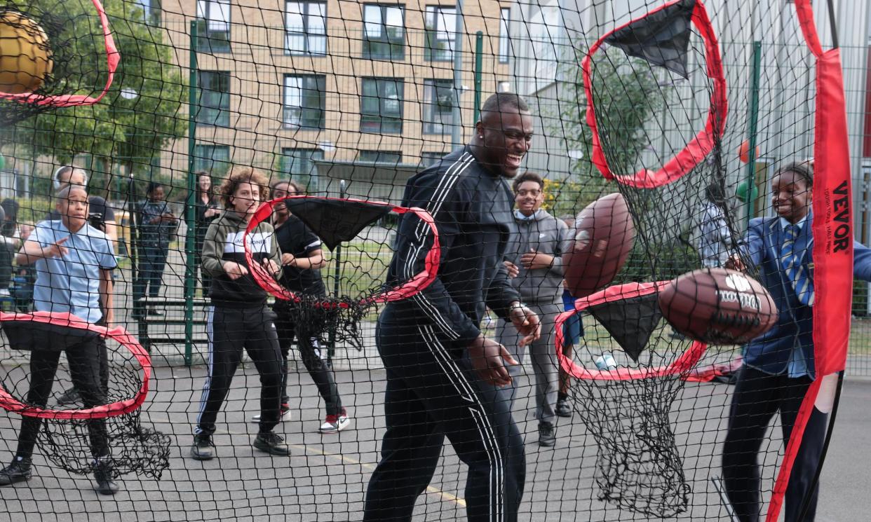 <span>Efe Obada on a visit to Roundwood Youth Centre in Harlesden, north London.</span><span>Photograph: Martin Godwin/The Guardian</span>