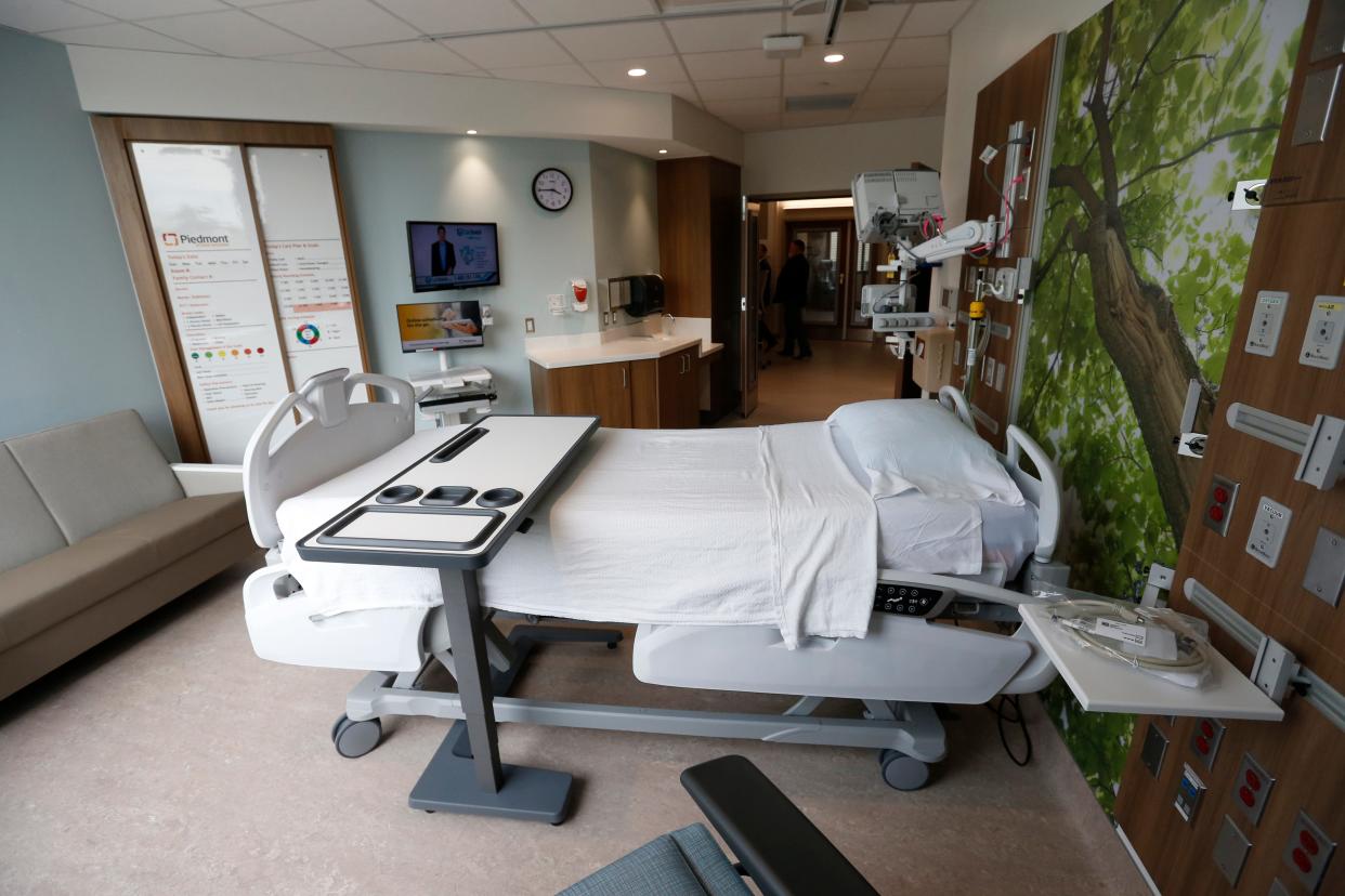 FILE - Donors, staff and guests take a look inside a hospital room inside Piedmont Athens Regional Medical Center's new patient tower in Athens, Ga., on Thursday, April 21, 2022.