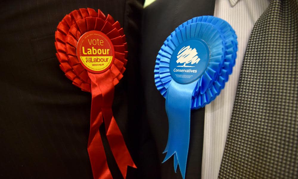 Conservative Party and Labour Party rosettes