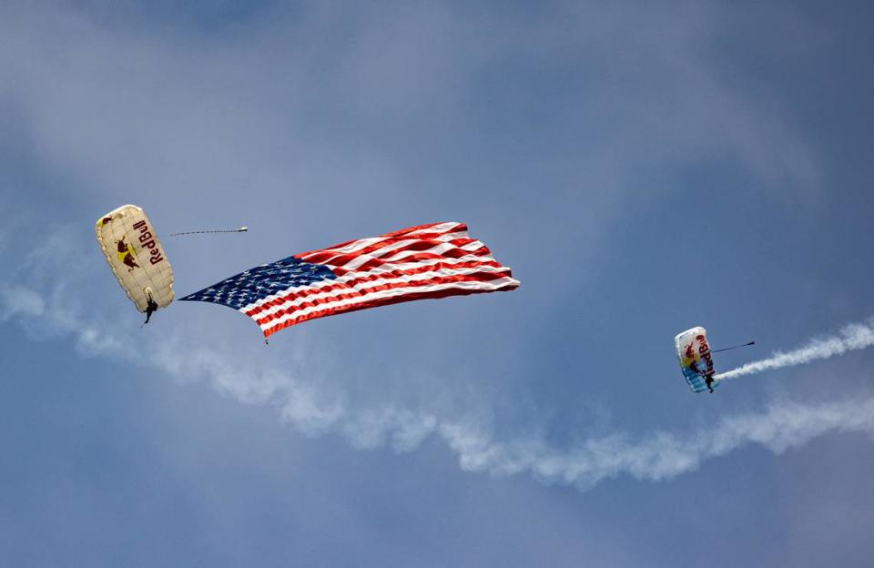 Red Bull sky divers perform at the Scott AFB airshow. The event continues all day Sunday at Scott Air Force Base. For information on the schedule, visit bnd.com.