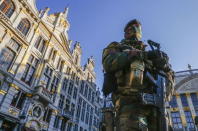 A Belgian soldier patrols in Brussels' Grand Place as police searched the area during a continued high level of security following the recent deadly Paris attacks, Belgium, November 23, 2015. REUTERS/Yves Herman