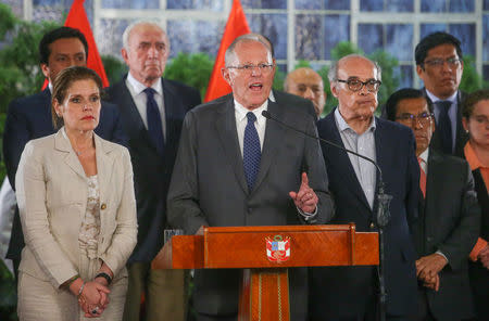 Peruvian President Pedro Pablo Kuczynski (C), flanked by vice-president Mercedes Araoz (L) and his cabinet, gives a speech at the Government Palace in Lima, Peru, December 14, 2017. Peruvian Government Palace/Handout via Reuters.