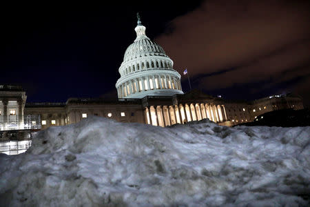 FILE PHOTO: The U.S. Capitol is seen behind a snow pile in Washington, U.S., January 16, 2019. REUTERS/Yuri Gripas/File Photo