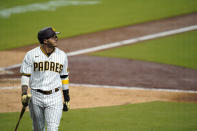 San Diego Padres' Manny Machado walks back to the dugout after striking out during the sixth inning of a baseball game against the Arizona Diamondbacks, Friday, Aug. 7, 2020, in San Diego. (AP Photo/Gregory Bull)