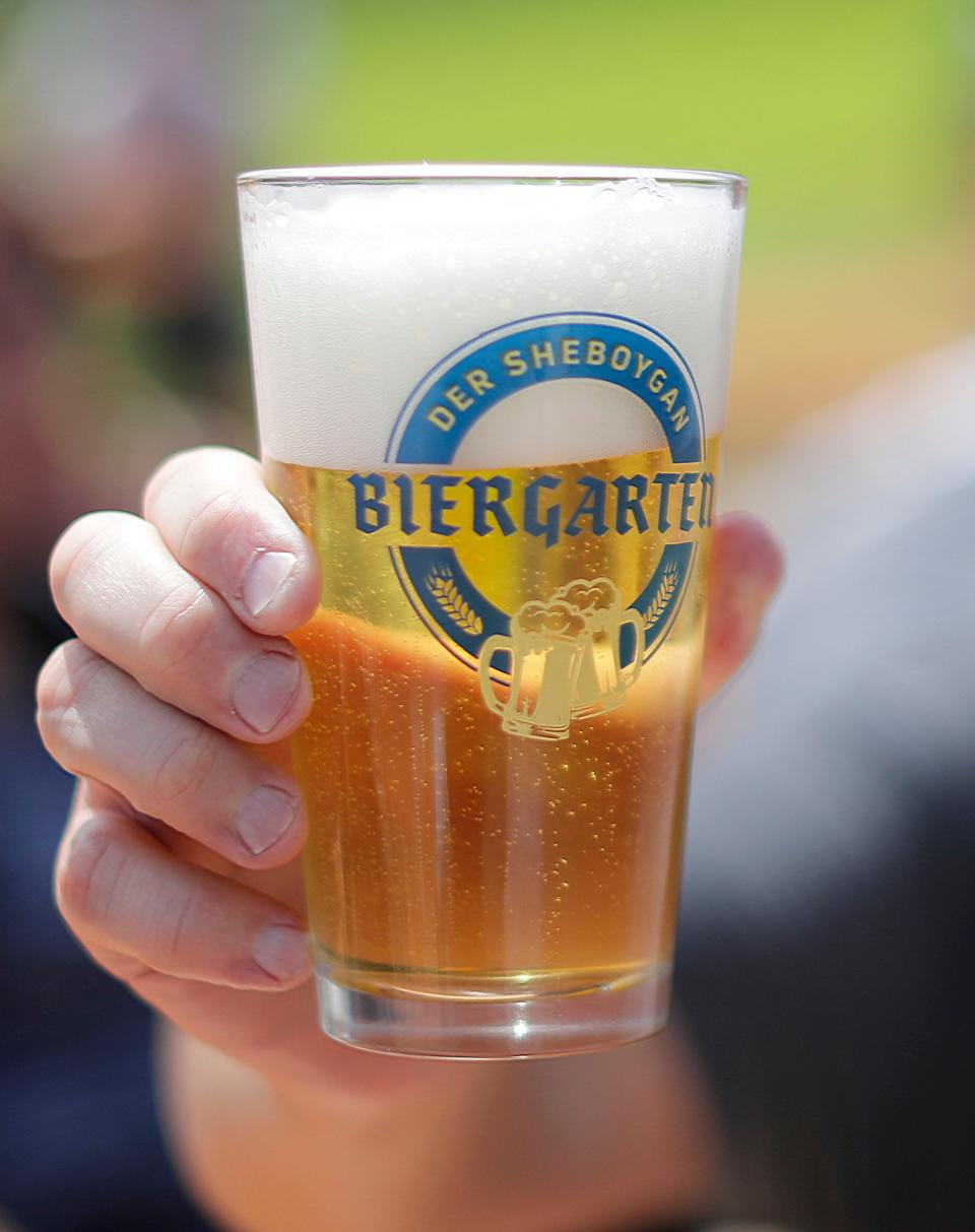 The first 50 people had a special pint glass commemorating the opening of the der Sheboygan Biergarten at Kiwanis Park, Saturday, May 25, 2019, in Sheboygan, Wis.