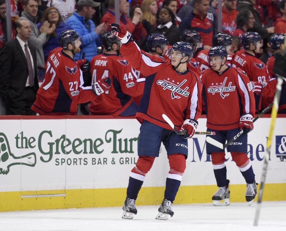 Washington Capitals left wing Andre Burakovsky (65), of Austria, (65) gestures as he celebrates his goal during the second period of an NHL hockey game against the Philadelphia Flyers, Sunday, Jan. 15, 2017, in Washington. (AP Photo/Nick Wass)