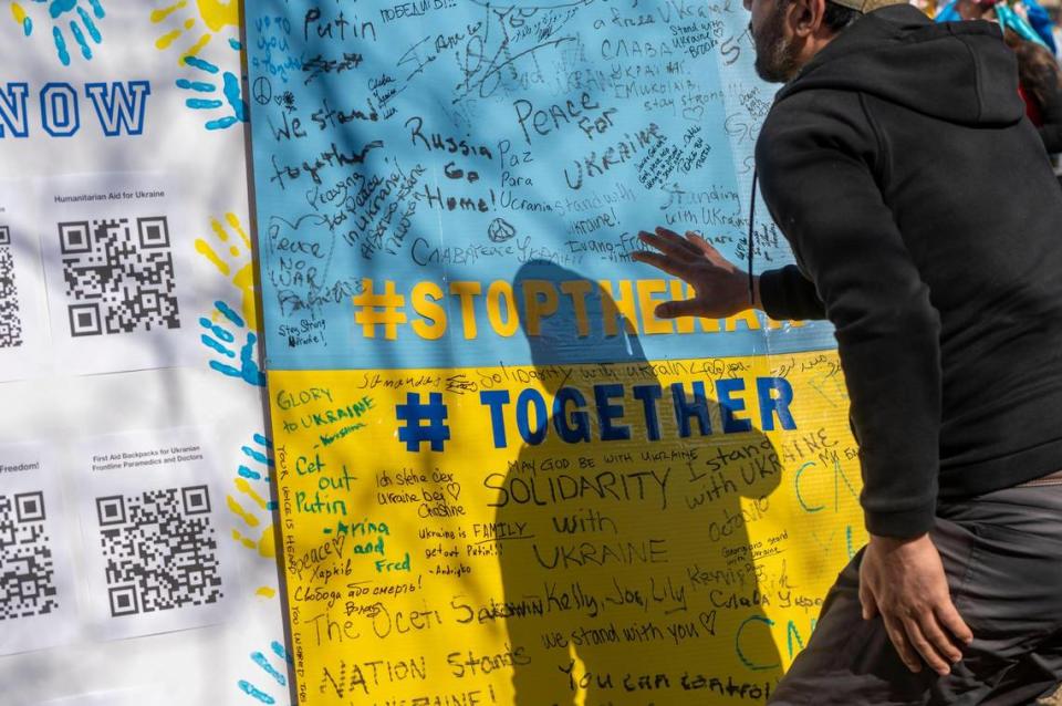 A poster for people to write messages was on display at a demonstration at The Plaza on Saturday, Feb. 26, 2022. The protest was held in response to the recent military invasion by Russia.