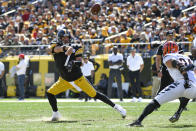 Pittsburgh Steelers quarterback Ben Roethlisberger (7) gets a pass off past Cincinnati Bengals defensive end Sam Hubbard (94) during the first half an NFL football game, Sunday, Sept. 26, 2021, in Pittsburgh. (AP Photo/Don Wright)