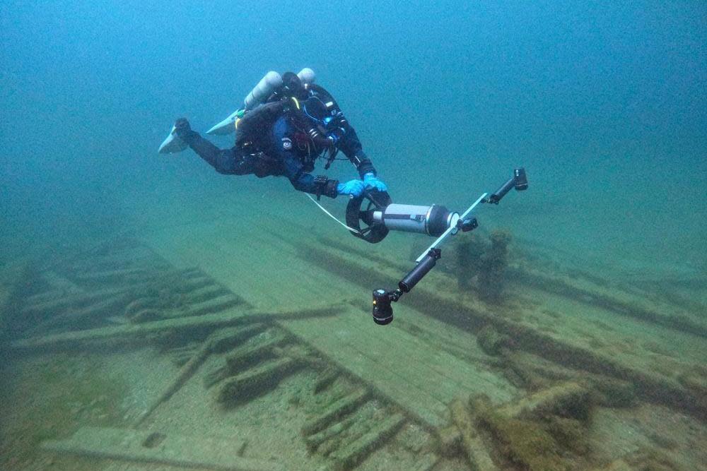 <span>Zach Whitrock explores the wreck of the Margaret A Muir in Lake Michigan near Algoma, Wisconsin, on 2 June 2024.</span><span>Photograph: Tamara Thomsen/AP</span>