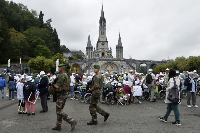 In keeping with security protocols in terror-scarred France, 300 police officers and soldiers were deployed to protect the worshippers in Lourdes, who were searched upon entry to the site
