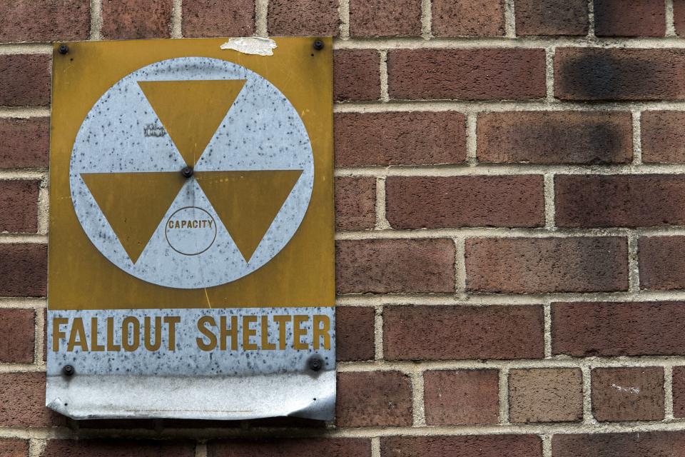 A fallout shelter sign hangs on a building on East 9th Street in New York, Jan. 16, 2018.