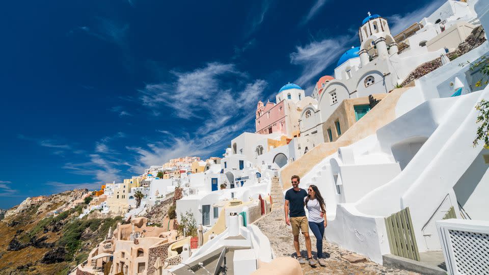 Oia village on the Greek island of Santorini is charming and offers stunning views. And you could be in for stunning prices -- or shut out completely -- if you wait too late to book a trip there next summer. - amriphoto/E+/Getty Images