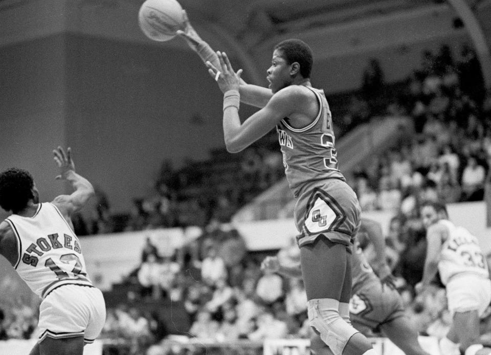 Georgetown freshman Patrick Ewing (33) starts a fast break over Ohio State's Ron Stokes (12) in their Great Alaska Shootout game in Anchorage, Nov. 29, 1981. Ohio State won 47-46.
