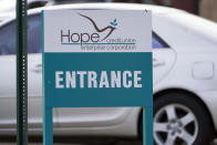 An entrance sign announces the corporate office of Hope Enterprise Corporation, which runs a Mississippi-based credit union in Jackson, Miss., Monday, Feb. 8, 2021. Hope Enterprise Corporation is partnering with seven cities and nine historically Black colleges and universities to launch the “Deep South Economic Mobility Collaborative." Goldman Sachs 10,000 Small Businesses initiative is providing up to $130 million to the endeavor, which will be available to clients in Louisiana, Mississippi, Alabama, Arkansas and Tennessee. (AP Photo/Rogelio V. Solis)