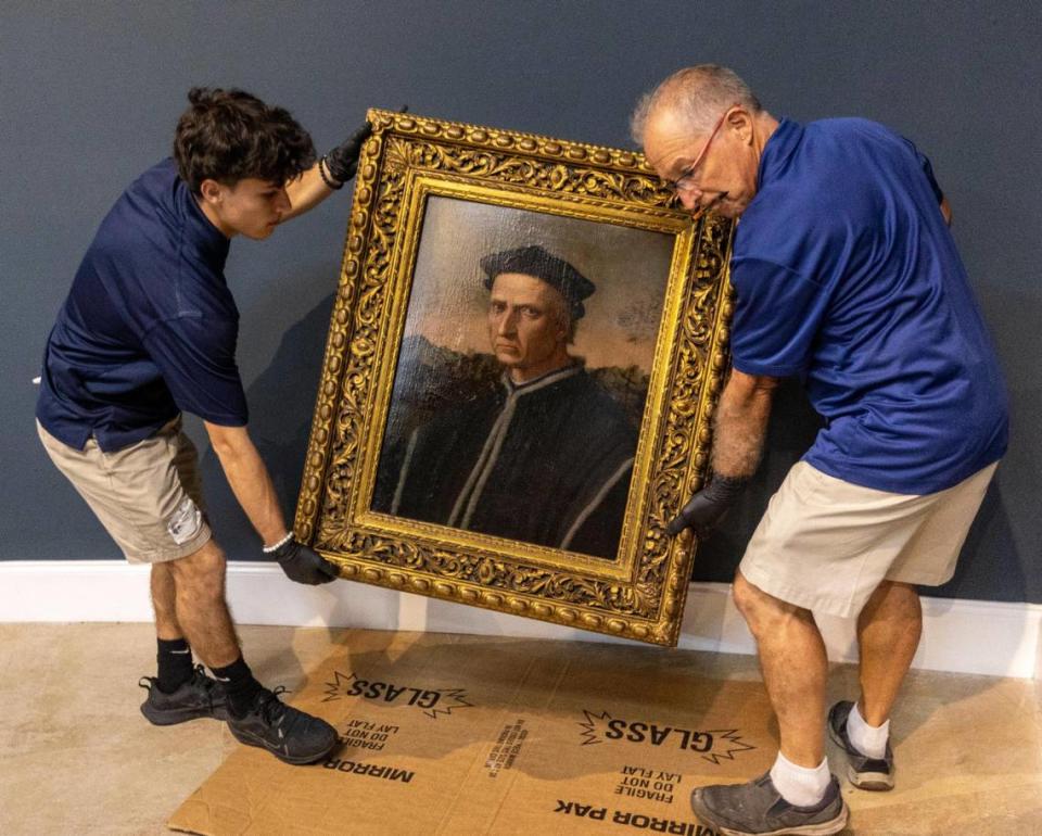 Miami, Florida, Sept. 5, 2023 - A team from Betsy Frank Gallery prepares to hang a painting titled, ‘Portrait of Pier Soderini,’ circa 1515 by Ridolfo del Ghirlandaio, on the walls of the gallery at Belen Jesuit Preparatory School. The work is part of an exhibit, ‘Faith, Beauty and Devotion: Medieval, Renaissance, and Baroque Paintings,’ which opens Saturday, Sept. 16, 2023, and runs through Dec. 16, 2023.