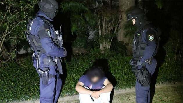 One of fifteen men arrested in Sydney during Australia's largest counter-terror operation. Photo: Supplied by NSW Police