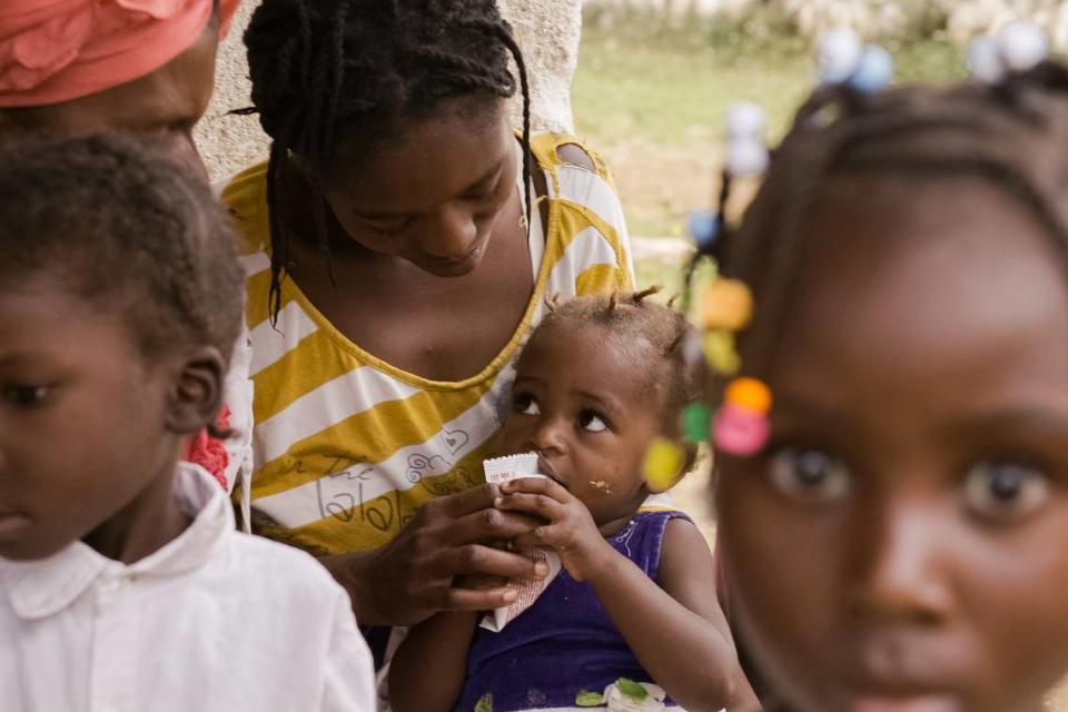 Child eating peanuts at a health center for nutrition in southeast Haiti in September 2019.