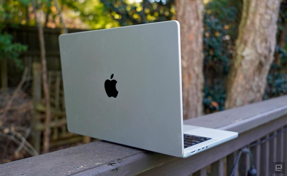 Apple MacBook Pro 14-inch from the rear, s،wing off the Apple logo.