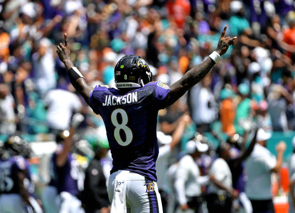 Sep 8, 2019; Miami Gardens, FL, USA; Baltimore Ravens quarterback Lamar Jackson (8) celebrates after throwing a touchdown pass against the Miami Dolphins during the first half at Hard Rock Stadium. Mandatory Credit: Steve Mitchell-USA TODAY Sports