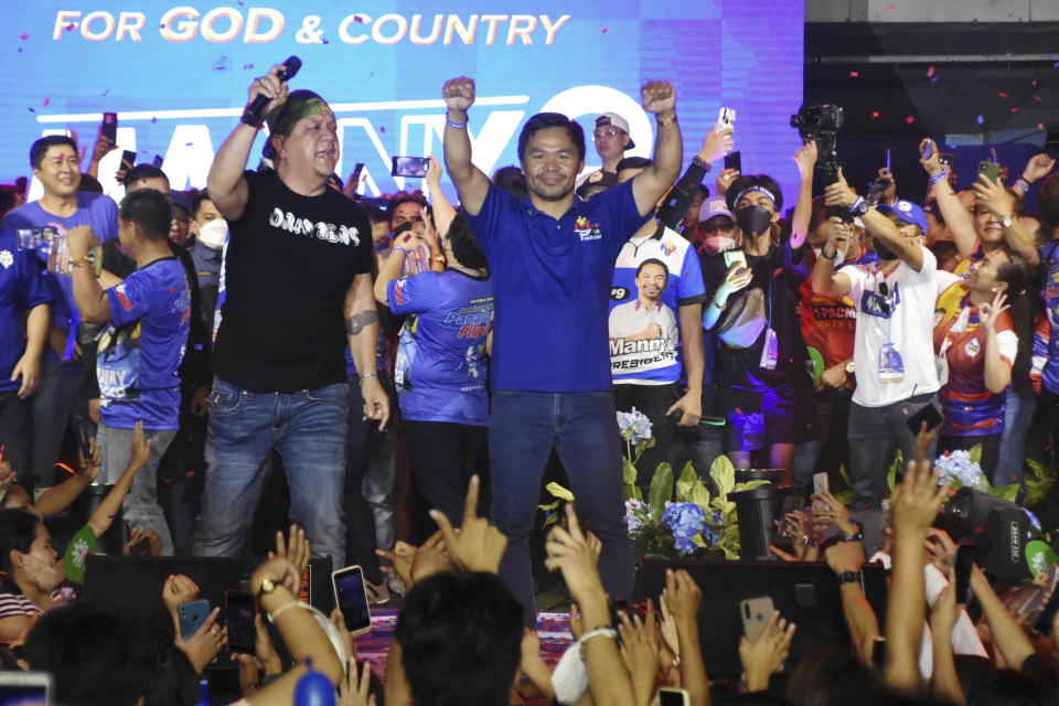 Presidential candidate and boxing legend Senator Manny "Pacman" Pacquiao gestures to the crowd during the last campaign rally known as "Miting De Avance" on Saturday, May 7, 2022 in General Santos city, southern Philippines. About 67 million registered Filipino voters will pick a new president on Monday, with Ferdinand Marcos, Jr, son and namesake of the ousted dictator leading pre-election surveys, and incumbent Vice President Leni Robredo, who leads the opposition, as his closest challenger. (AP Photo)