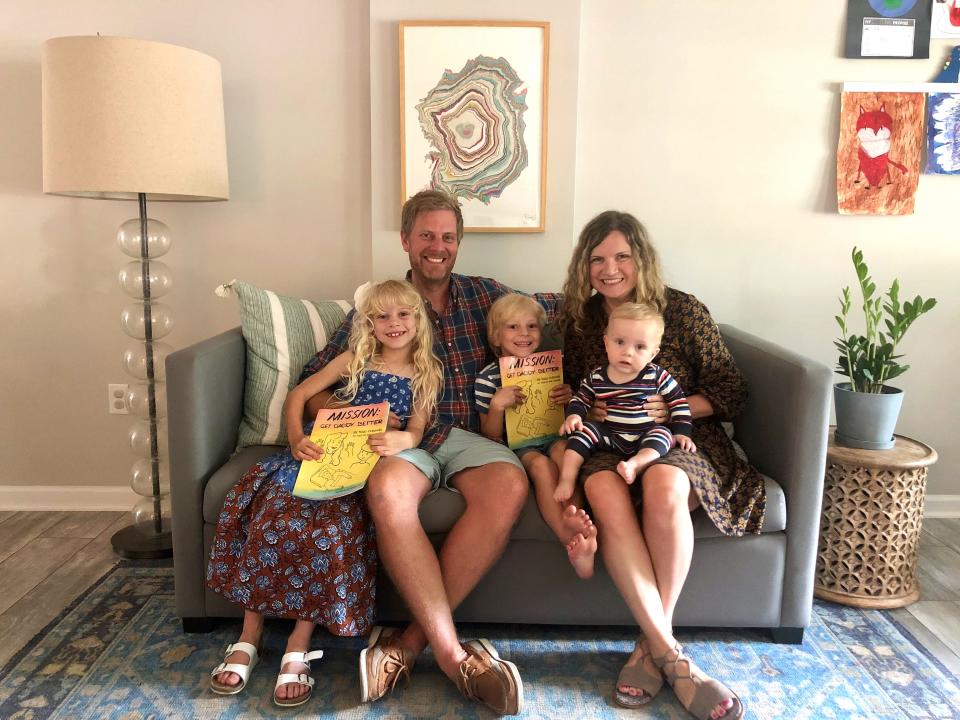 Todd McElwee, second from left, wrote the children's book "Mission: Get Daddy Better" about his recovery from a brain injury. The book is narrated by his then 4-year-old daughter Evie, left, who tells about what her and brother Declan, center, thought and did to help their dad get better.