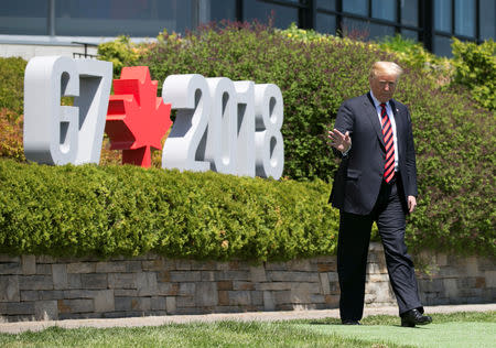 FILE PHOTO - U.S. President Donald Trump arrives for the official welcoming ceremony the G7 Summit in the Charlevoix town of La Malbaie, Quebec, Canada, June 8, 2018. REUTERS/Christinne Muschi