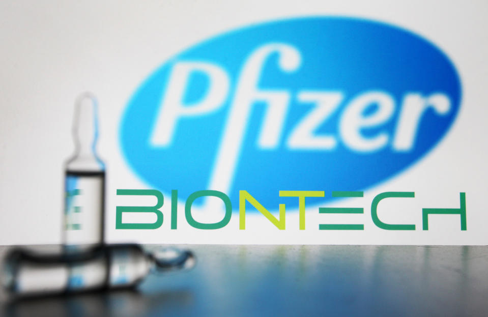 In this photo illustration ampules seen in front of American multinational pharmaceutical corporation Pfizer and German biotechnology company Biontech logos. (Photo by Pavlo Gonchar / SOPA Images/Sipa USA)