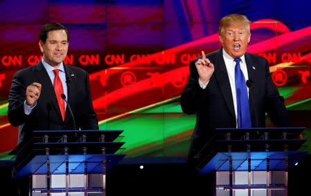 Republican U.S. presidential candidates Marco Rubio (L) and Donald Trump speak simultaneously as they discuss an issue during the debate sponsored by CNN for the 2016 Republican U.S. presidential candidates in Houston, Texas, February 25, 2016. REUTERS/Mike Stone