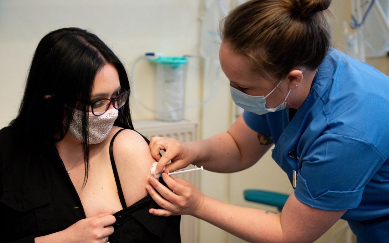 Prof Jason Leitch and Nicola Sturgeon urged Scots to take up the offer of a vaccination, with the risks of blood clots "vanishingly small" - PA