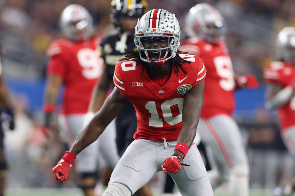 Dec 29, 2023; Arlington, TX, USA; Ohio State Buckeyes cornerback Denzel Burke (10) reacts after making a tackle against the Missouri Tigers in the first quarter at AT&T Stadium. Mandatory Credit: Tim Heitman-USA TODAY Sports