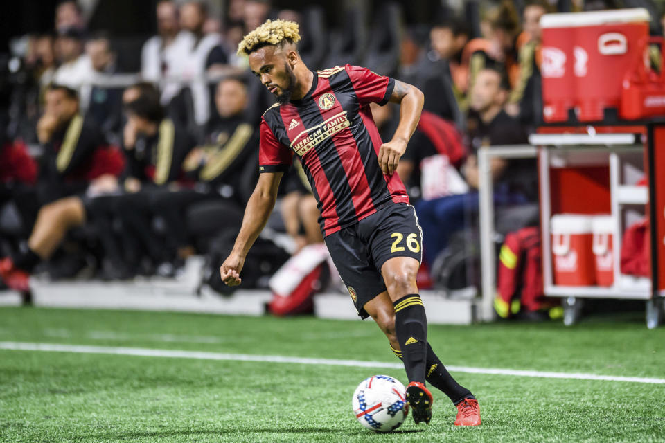 FILE - Atlanta United midfielder Anton Walkes (26) moves the ball during the first half of an MLS playoff soccer game, in Atlanta against Columbus Crew, Thursday, Oct. 26, 2017. Soccer player Anton Walkes, who started his career at Tottenham, died Thursday, Jan. 19, 2023, after an accident in Florida, his MLS club Charlotte FC said. He was 25. (AP Photo/Danny Karnik, File)