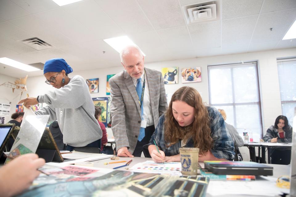 Arlington Community Schools Superintendent Jeff Mayo talks with a student about their art project  at Arlington High School  during a school day on Nov. 9, 2022 in Arlington, TN.