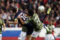 Paris St Germain's Zlatan Ibrahimovic challenges Bastia's Francois-Joseph Modesto (R) and scores his first goal during their French Ligue 1 soccer match at the Parc des Princes Stadium in Paris October 19, 2013. REUTERS/Benoit Tessier (FRANCE - Tags: SPORT SOCCER)